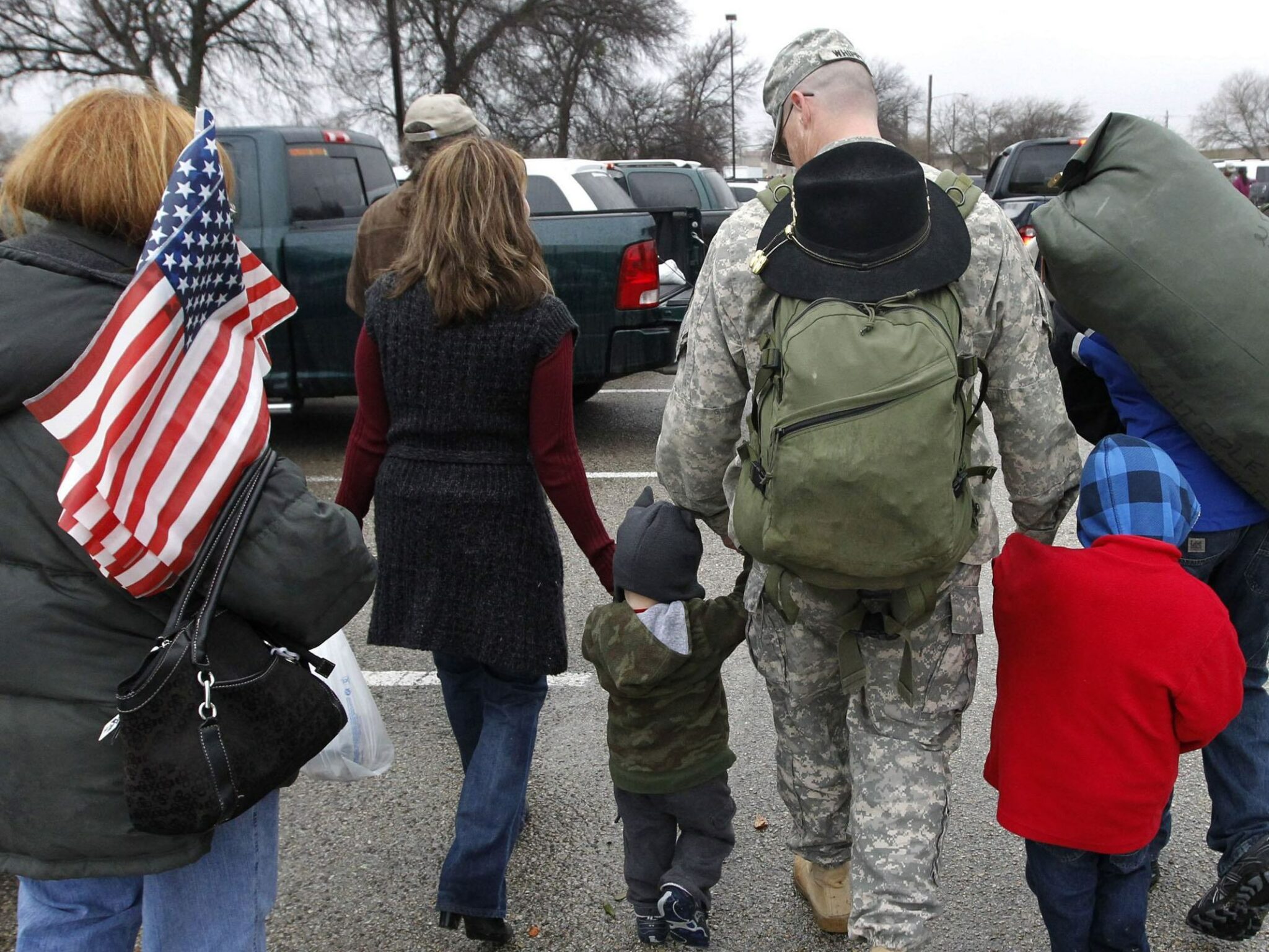A soldier walks with his family following a 2011 ceremony at Fort Hood, Texas, for soldiers from the U.S. Army 1st Cavalry 3rd Brigade, who returned home from deployment in Iraq